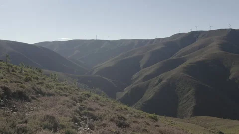 Big mountain with windmills on top Stock Footage 237339604
