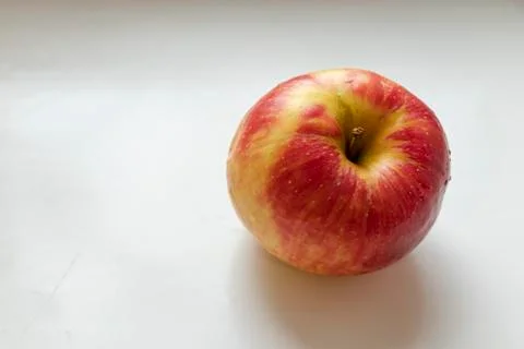 Big multi-colored apple. Red. Yellow. Green. On the white background. Stock Photos