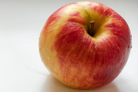 Big multi-colored apple. Red. Yellow. Green. On the white background. 库存照片