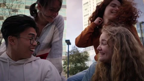 Big multi-ethnic group young friends laughing outdoor. Cheerful people of Stock Footage 248326310
