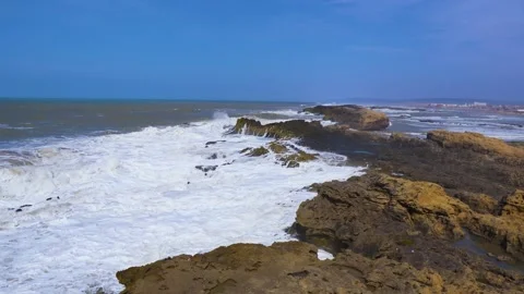 Big ocean waves crash against the rocks on the coast. Stock Footage 223180304