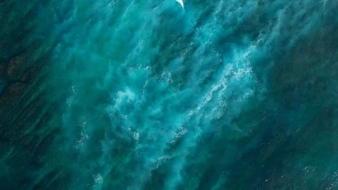 Big ocean waves hitting a coral rif. Aerial 4k footage. Stock Footage 129503385