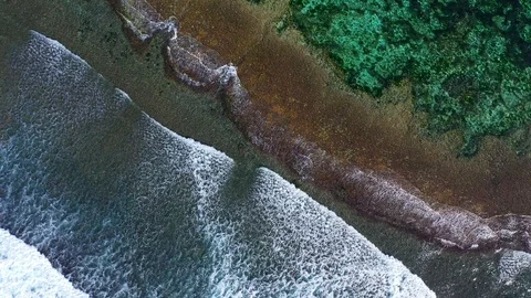 Big ocean waves hitting a coral rif. Aerial 4k footage. Stock Footage 129504063