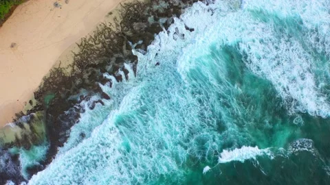 Big ocean waves hitting a rocky beach. Aerial 4k footage. Stock Footage 130871485