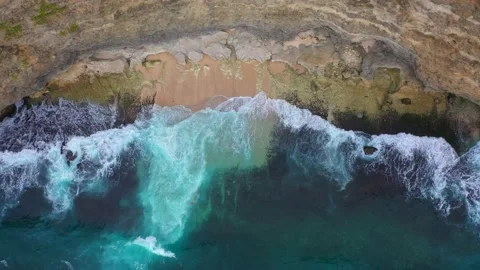 Big ocean waves hitting a rocky beach. Aerial 4k footage. Stock Footage 130871670