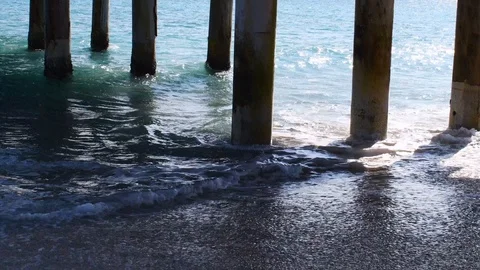 Big ocean waves under a pier Stock Footage 108642065
