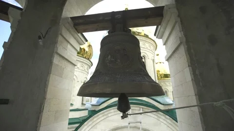 The big old bell on the tower rings on a holiday 4K Stock Footage 120727374