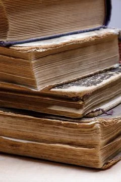 Big old book pages close up on corner low depth of field, vintage paper texture Stock Photos