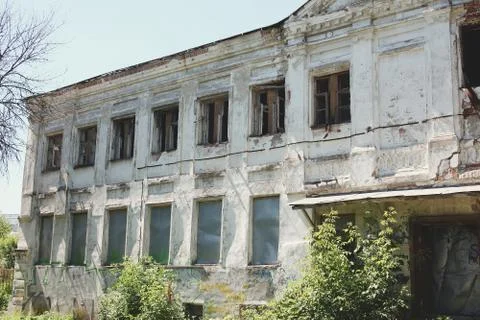 Big old brick burnt abandoned house with windows Stock Photos