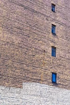 Big old brick wall with windows 库存照片