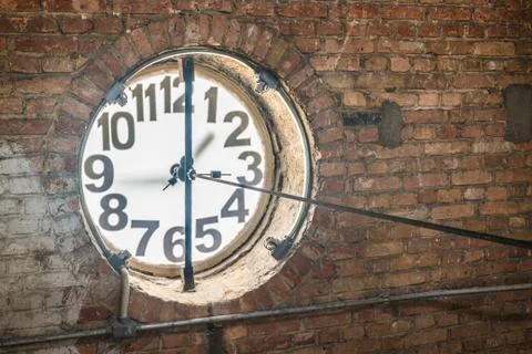 Big old clock embeded on the wall Stock Photos
