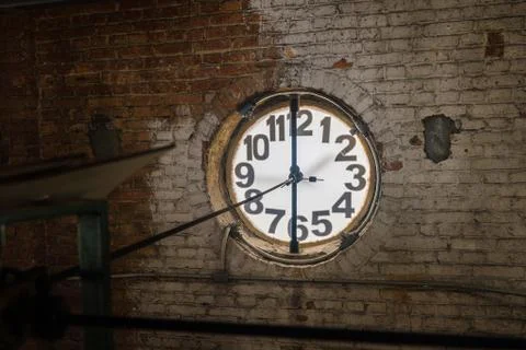 Big old clock embeded on the wall Stock Photos
