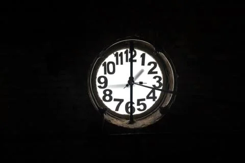 Big old clock embeded on the wall Stock Photos