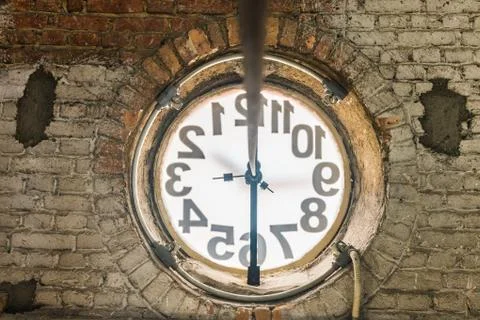 Big old clock embeded on the wall Photos
