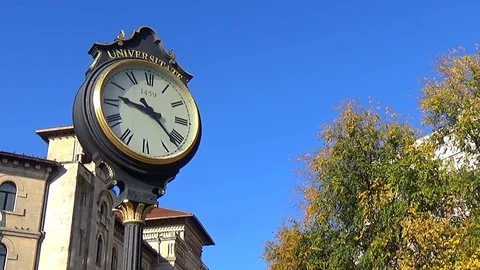 The big old style clock in the middle of University's square, Bucharest, Romania Stock Footage 71655720