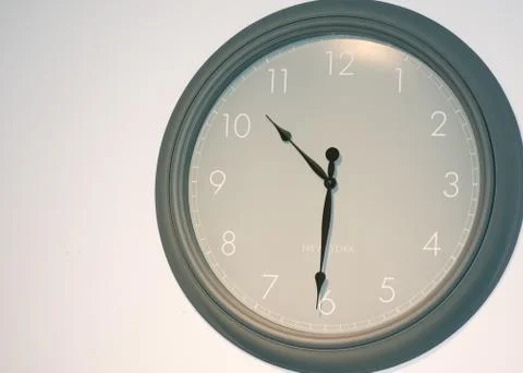 Big olive green wall clock with New York lettering on it Stock Photos