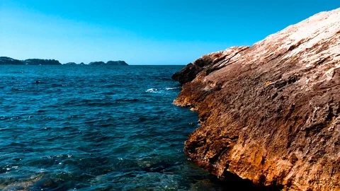 Big orange rock at majorca Stock Footage 90552015