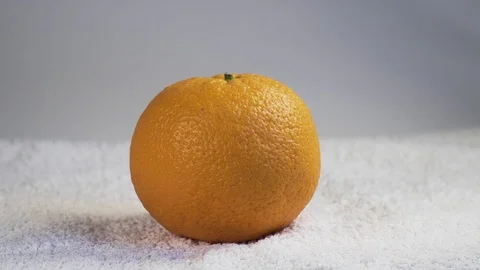 Big orange is on the white background Stock Footage 127857501