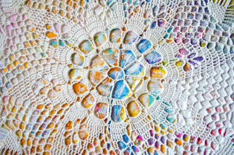 Big painted napkin with geometric pattern on abstract colorful acrylic backgr Stock Photos