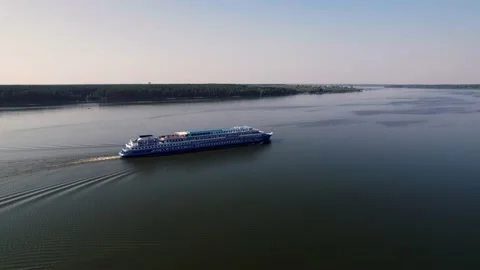 Big passanger ship is sailing on a river. Aerial view. Strafe sliding flight Stock Footage 219568339
