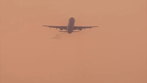 Big passenger airliners fly within sunset sky 스톡 동영상 167918772