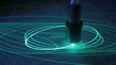 Big pendulum draws ellipses with light on phosphorus surface Stock Footage 84653041