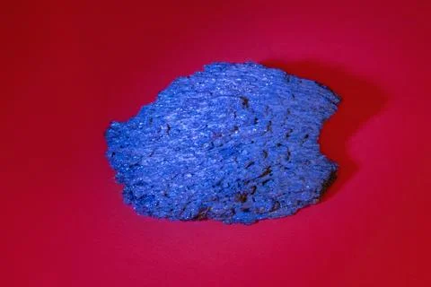 Big piece of blue black solid faceted mineral corundum Stock Photos