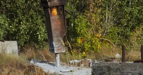 Big piece of concrete is being destroyed with a jackhammer machine, 4k Stock Footage 155050367