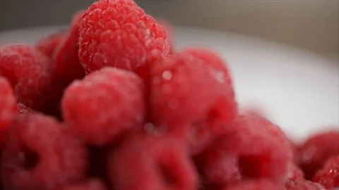Big Pile of Raspberries lying on a Rotating Plate Closeup No. 1 Stock Footage 99162956