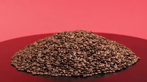 A big pile of roasted coffee beans. Composition in red and black tones. Stock Footage 245087397