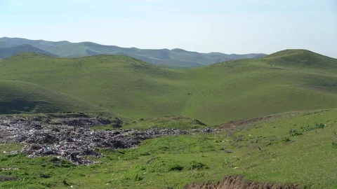 Big piles of garbage. Empty bottles, plastic in the waste dump Stock Footage 106020266