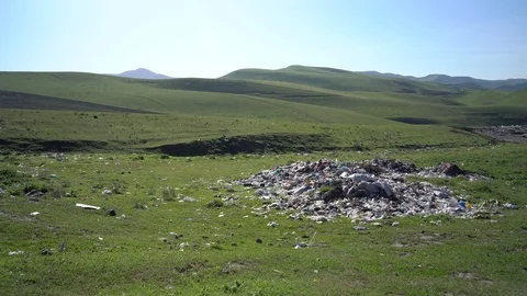 Big piles of garbage. Empty bottles, plastic in the waste dump Stock Footage 106046446