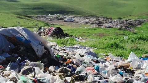 Big piles of garbage. Empty bottles, plastic in the waste dump Video stock 106047499