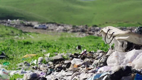 Big piles of garbage. Empty bottles, plastic in the waste dump Stock Footage 106049972