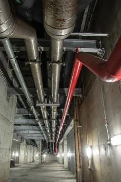Big pipe under the building Stock Photos