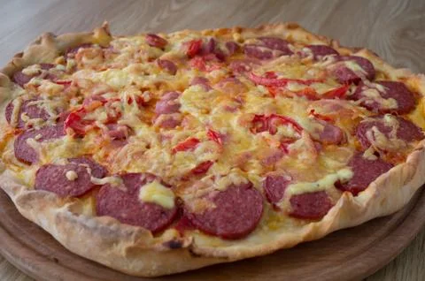 Big pizza on a board Stock Photos