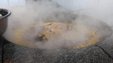 Big plov pot with steam Stock Footage 269130461