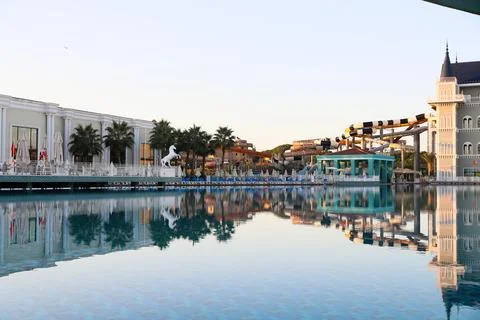 Big pool with water slide view Stock Photos