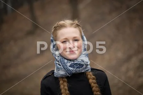 Big portrait of beautiful red-haired girl in scarf Stock Photos