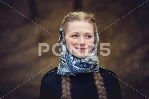 Big portrait of beautiful red-haired girl in scarf Stock Photos