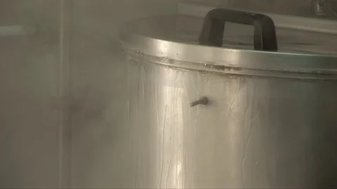 A big pot boiling Stock Footage 75813359