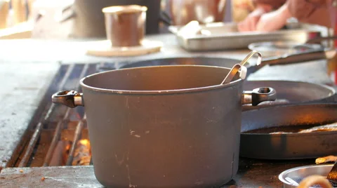 Big pot on the side of the grilling area Stock Footage 53534391
