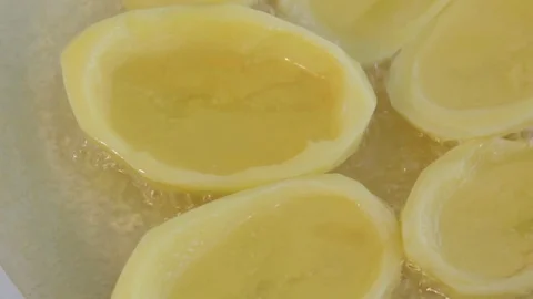 Big potato sliced chips frying in ceramic pan. Boiling oil. Close up. Macro. Stock-Footage 71122887