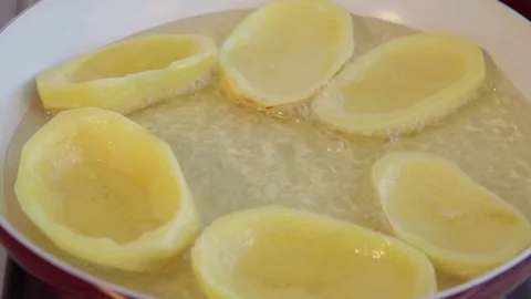 Big potato sliced chips frying in ceramic pan. Boiling oil. Close up. Stock-Footage 71123350