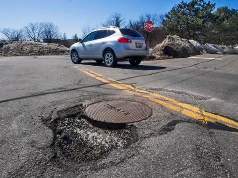 Big pothole in road Foto stock