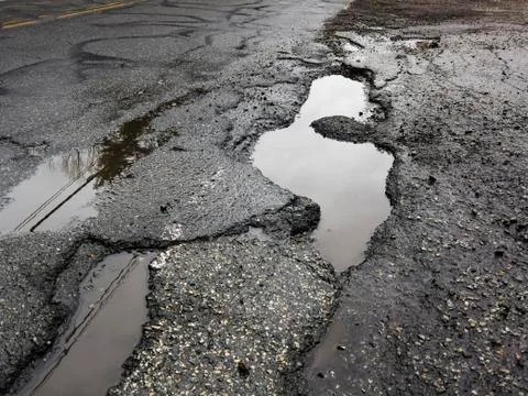 Big pothole in road Stock Photos