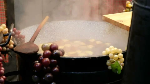 Big pots with hot mulled wine selling at the street, Budapest city Stock Footage 101381814