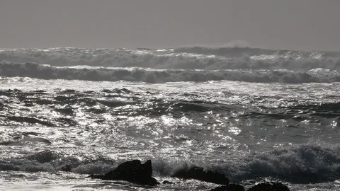 Big, powerful white surf waves on the ocean. Sun reflecting on water surface. Stock Footage 103632054