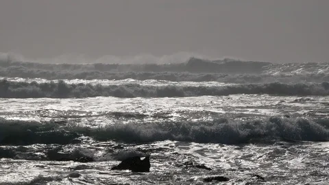 Big, powerful white surf waves on the ocean on a foggy day Stock Footage 103633631