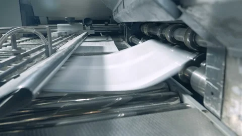 Big printer works with white paper on a conveyor in printing office. Stock Footage 113556443